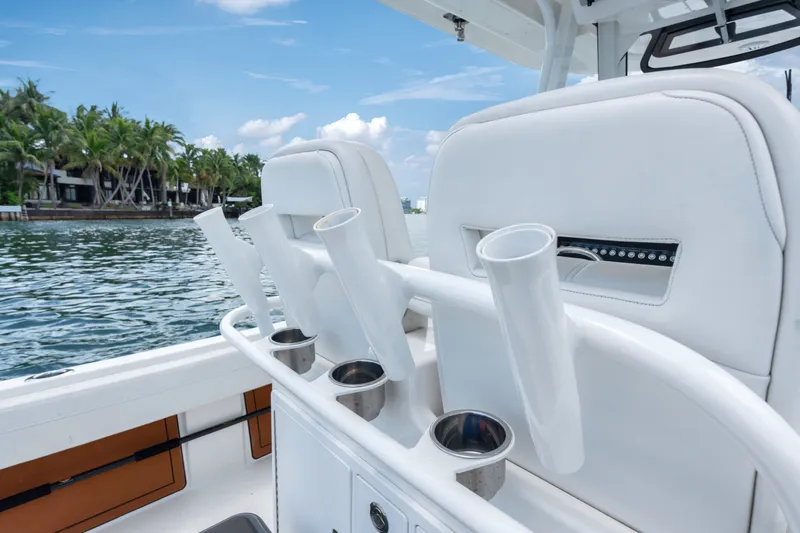 Slide: The Image of 2023 Regulator 28 Forward Seating boat interior with rod holders and cup holders. - 31