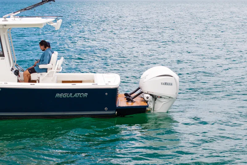 Slide: The Image of 2023 Regulator 28 Forward Seating boat with Yamaha engine on open water. - 10