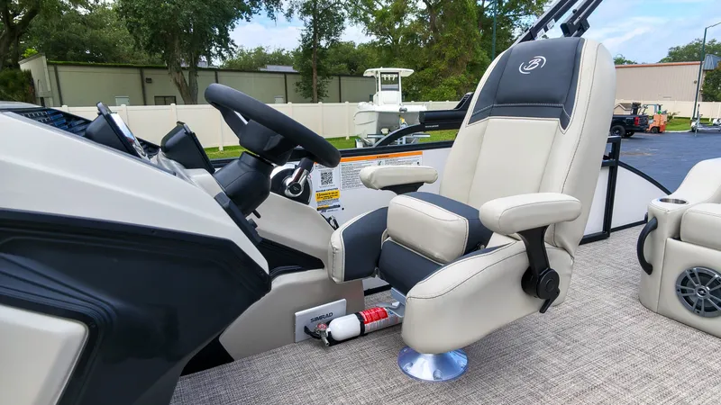 Slide: The Image of The image shows the helm of a 2027 Barletta Aria 24UC with a comfortable captain's chair. - 21