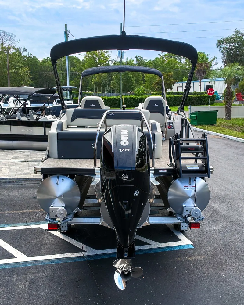 Slide: The Image of The image shows a 2027 Barletta Aria 24UC pontoon boat with a 250 HP V8 engine. - 6