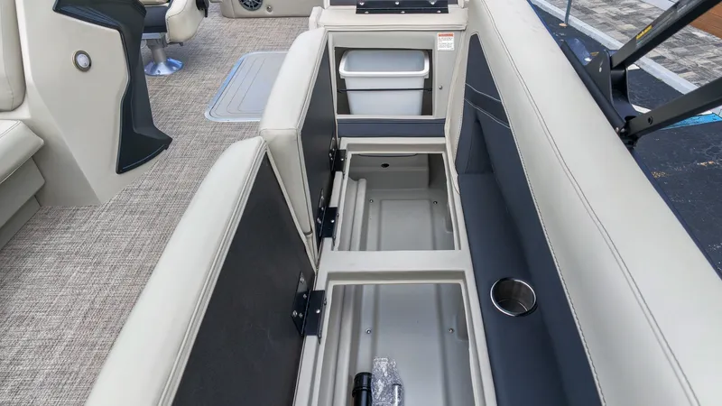 Slide: The Image of The image shows the interior of a 2027 Barletta Aria 24UC with open storage compartments. - 18