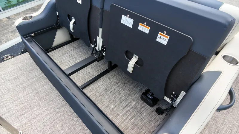 Slide: The Image of The 2027 Barletta Aria 24UC features a rear bench with foldable backrests and safety straps. - 8