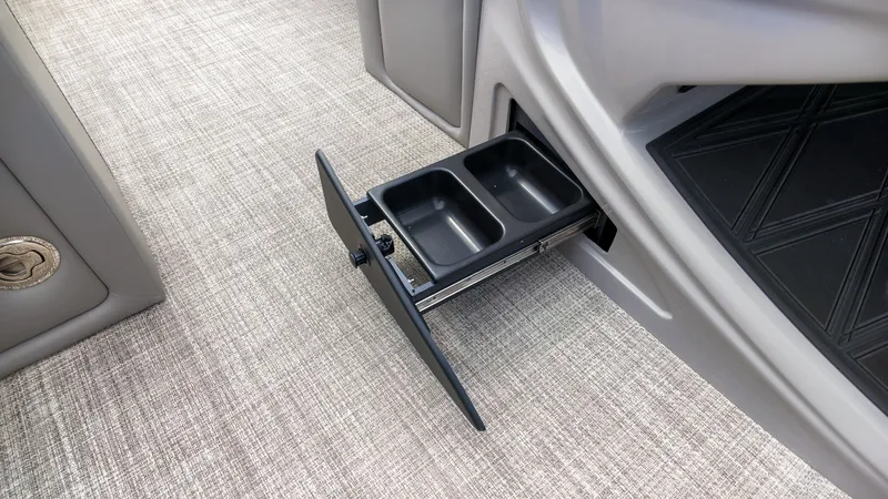 Slide: The Image of A pull-out cup holder in a Barletta Lusso 25UE boat, integrated into the flooring. - 28