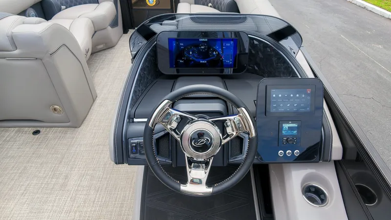 Slide: The Image of The image shows the cockpit of a 2027 Barletta Lusso 25UE with a modern steering wheel and digital displays. - 30