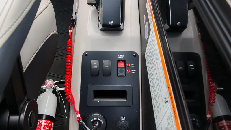 Slide: The Image of Close-up of the control panel with switches and a fire extinguisher. - 31