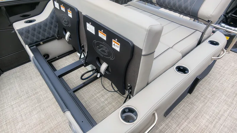 Slide: The Image of The 2027 Barletta Lusso 25UE features luxurious, cushioned seating with cup holders and sleek stitching. - 15