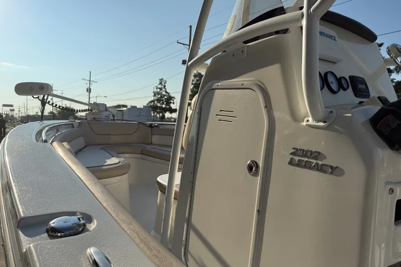 Slide: The Image of 2016 NauticStar 2302 Legacy boat interior with seating and control panel. - 16