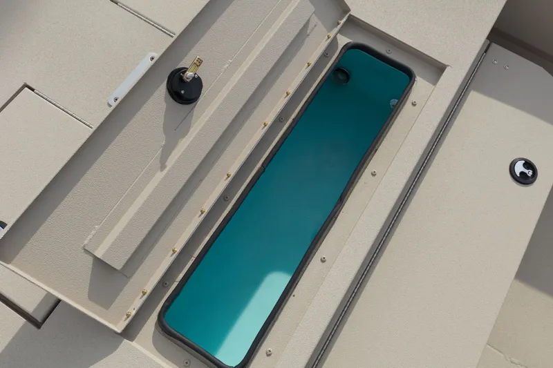 Slide: The Image of Open hatch on 2027 Avid 20 Rogue CC boat, revealing interior compartment. - 15