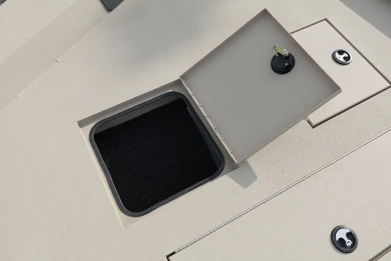 Slide: The Image of Open storage compartment on 2027 Avid 20 Rogue CC boat deck. - 14
