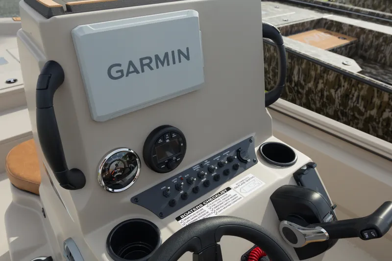 Slide: The Image of Control panel of 2027 Avid 20 Rogue CC boat with Garmin navigation system. - 17