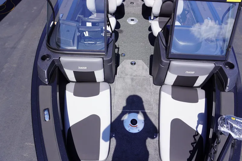 Slide: The Image of 2027 Tracker Targa V-18 Combo boat interior with dual consoles and seating. - 15