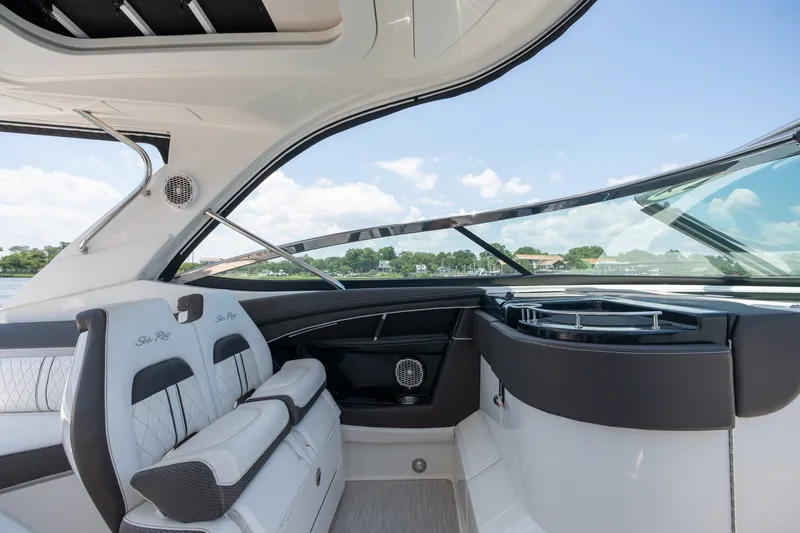 Slide: The Image of Interior view of 2017 Sea Ray SLX 350 boat with luxurious seating and sleek design. - 24