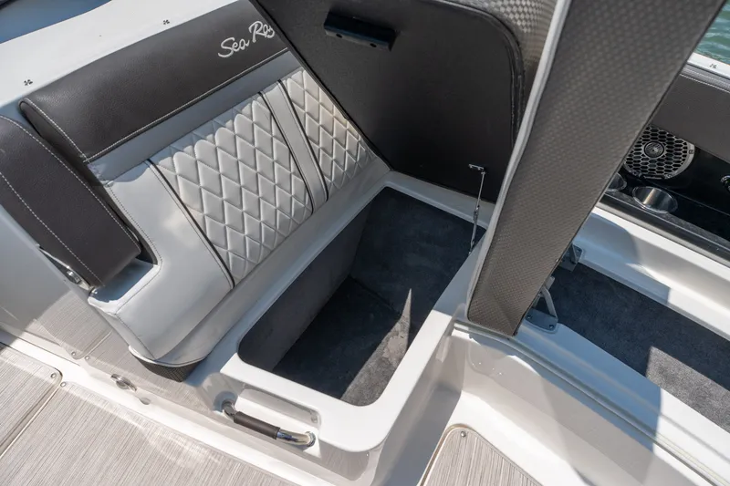 Slide: The Image of 2017 Sea Ray SLX 350 boat seat with storage compartment open. - 15