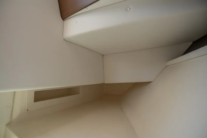 Slide: The Image of Interior view of a 2017 Sea Ray SLX 350 boat cabin, featuring sleek, angular design. - 31