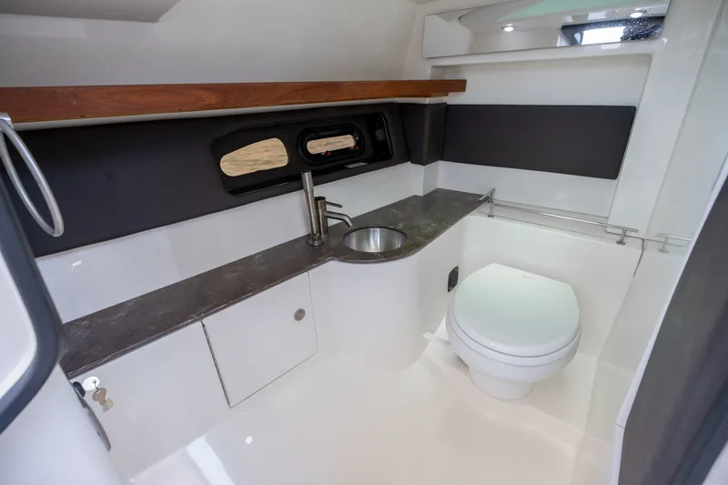 Slide: The Image of Luxurious 2017 Sea Ray SLX 350 boat bathroom with modern fixtures and sleek design. - 28