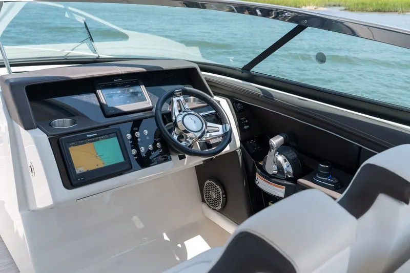 Slide: The Image of 2017 Sea Ray SLX 350 helm with modern navigation and control systems. - 20