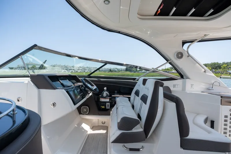 Slide: The Image of Interior of 2017 Sea Ray SLX 350 boat with modern helm and seating. - 23