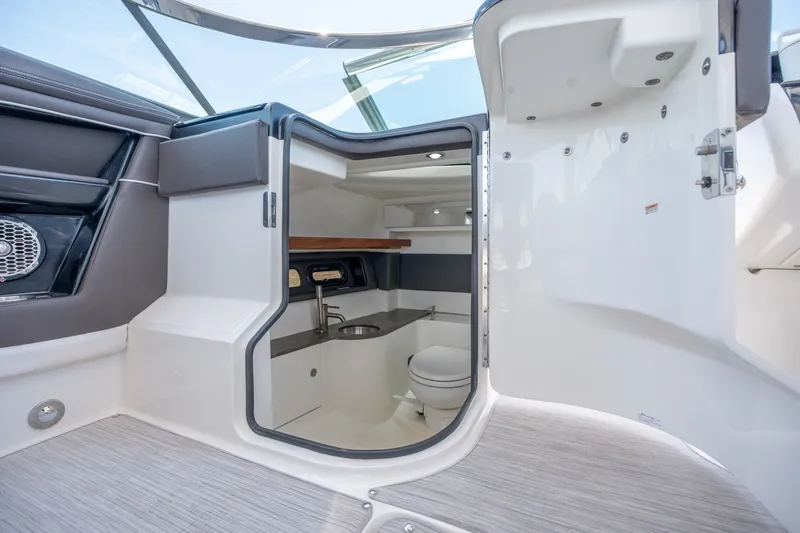 Slide: The Image of 2017 Sea Ray SLX 350 boat interior with modern bathroom amenities. - 27