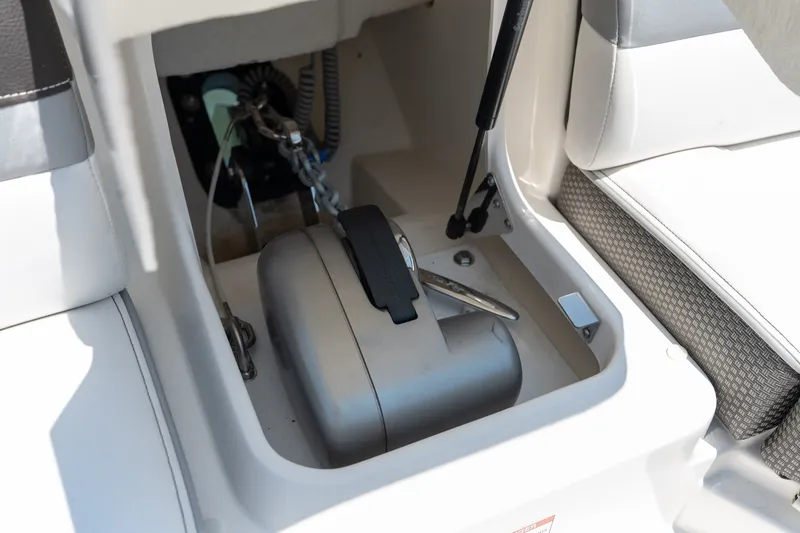 Slide: The Image of Storage compartment in a 2017 Sea Ray SLX 350 boat, featuring a secured anchor. - 17