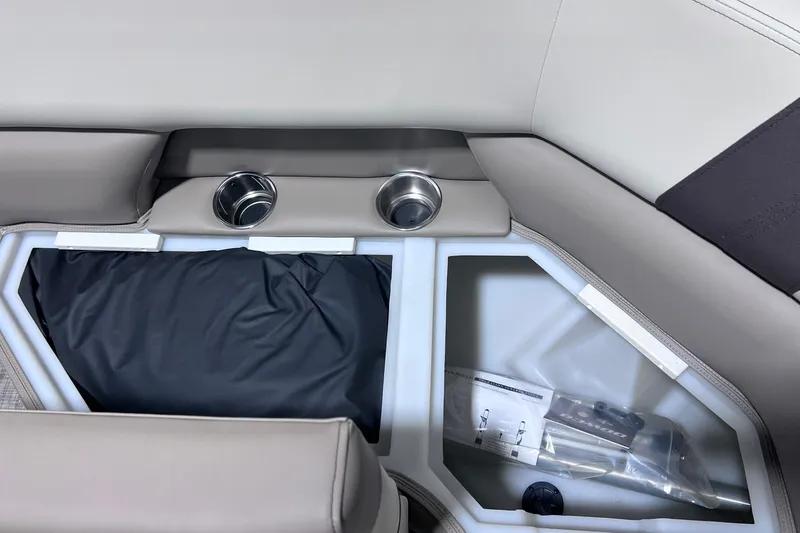 Slide: The Image of Interior of 2026 SunCatcher Select 20F boat with cup holders and storage compartment. - 17