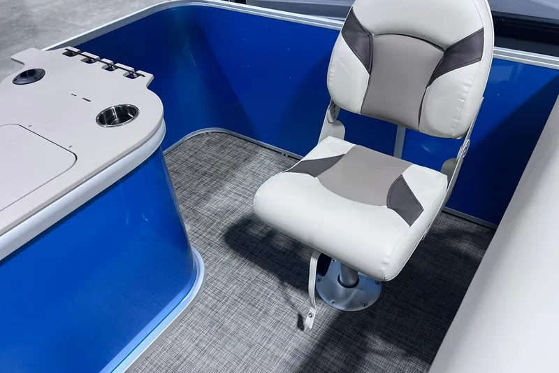 Slide: The Image of 2026 SunCatcher Select 20F boat interior with cushioned seat and blue paneling. - 18