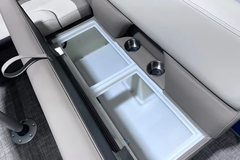 Slide: The Image of 2026 SunCatcher Select 20F boat interior with storage compartments and cup holders. - 16