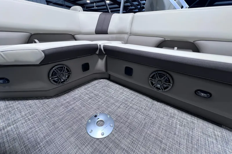 Slide: The Image of Interior of 2026 SunCatcher Select 20F boat with cushioned seating and built-in speakers. - 28