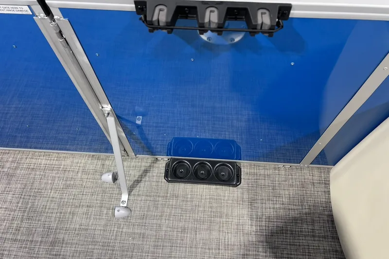 Slide: The Image of Interior view of 2026 SunCatcher Select 20F boat with blue panel and cup holders. - 15