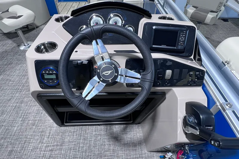 Slide: The Image of Steering console of 2026 SunCatcher Select 20F boat with modern controls and navigation display. - 22