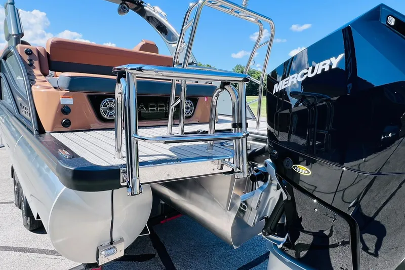Slide: The Image of 2027 Harris Grand Mariner 250 SL boat with Mercury engine, featuring sleek design and chrome details. - 34