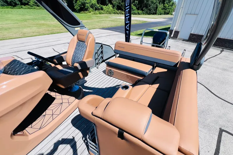 Slide: The Image of 2027 Harris Grand Mariner 250 SL boat interior with luxurious tan seating and modern design. - 9
