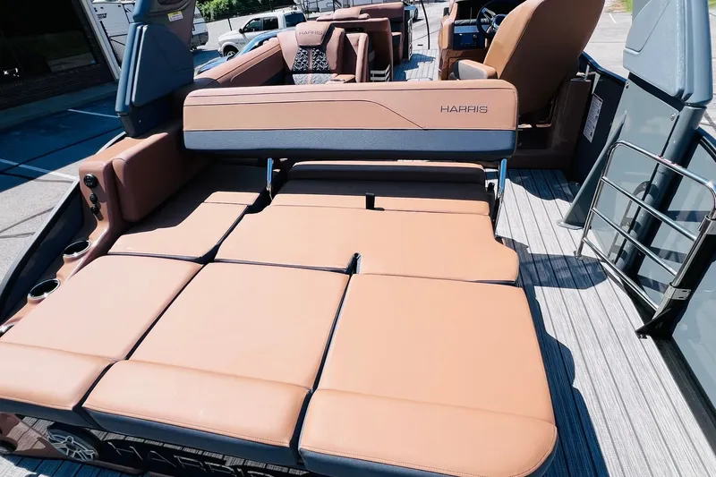 Slide: The Image of 2027 Harris Grand Mariner 250 SL boat interior with luxurious tan seating and modern design. - 33