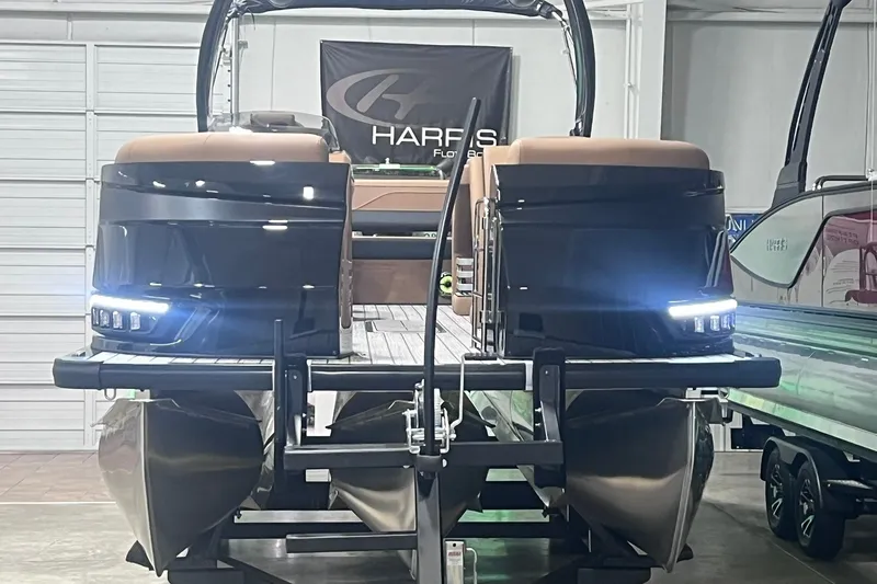 Slide: The Image of 2027 Harris Grand Mariner 250 SL pontoon boat in showroom with illuminated lights. - 57