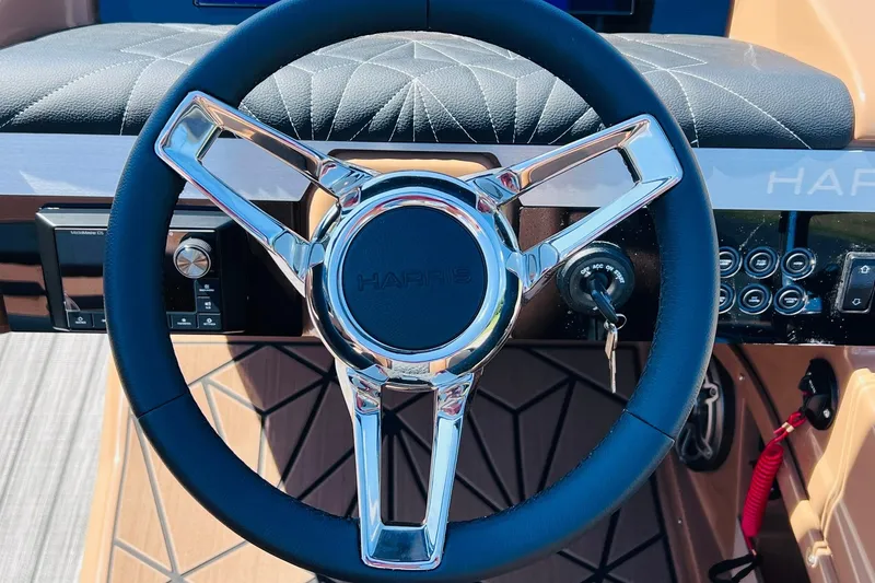 Slide: The Image of Steering wheel of 2027 Harris Grand Mariner 250 SL boat, featuring sleek design and controls. - 20