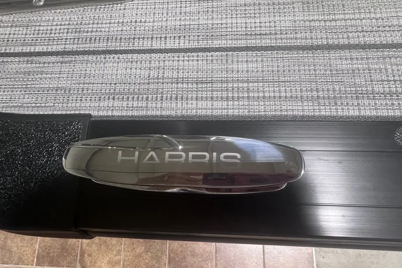 Slide: The Image of 2027 Harris Grand Mariner 250 SL boat detail with sleek design and branding. - 59