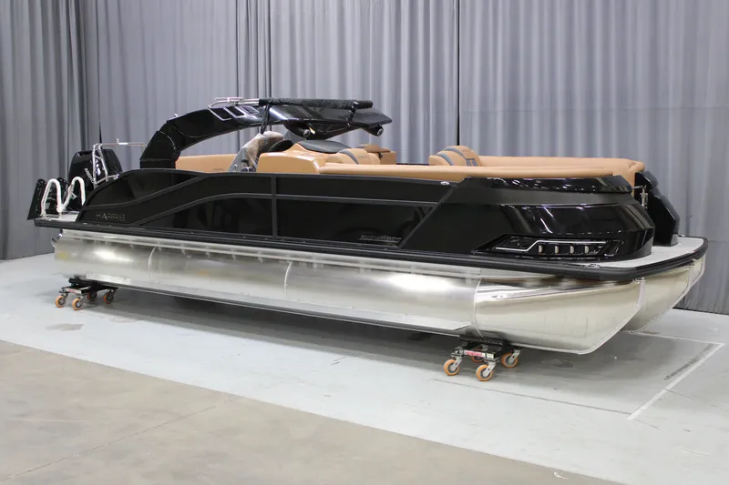 Slide: The Image of 2027 Harris Grand Mariner 250 SL pontoon boat with sleek black design and tan seating. - 63