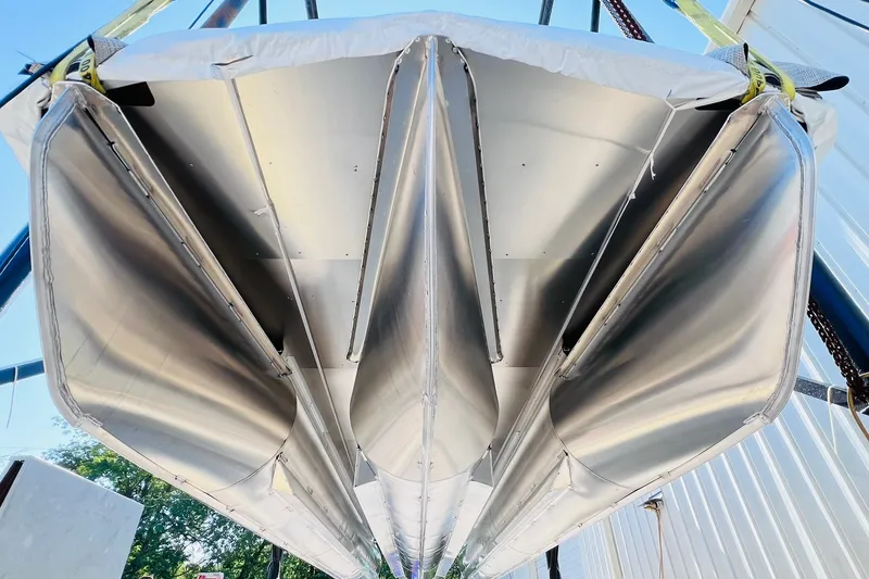 Slide: The Image of Underside view of 2027 Harris Grand Mariner 250 SL pontoon boat, showcasing sleek aluminum design. - 60