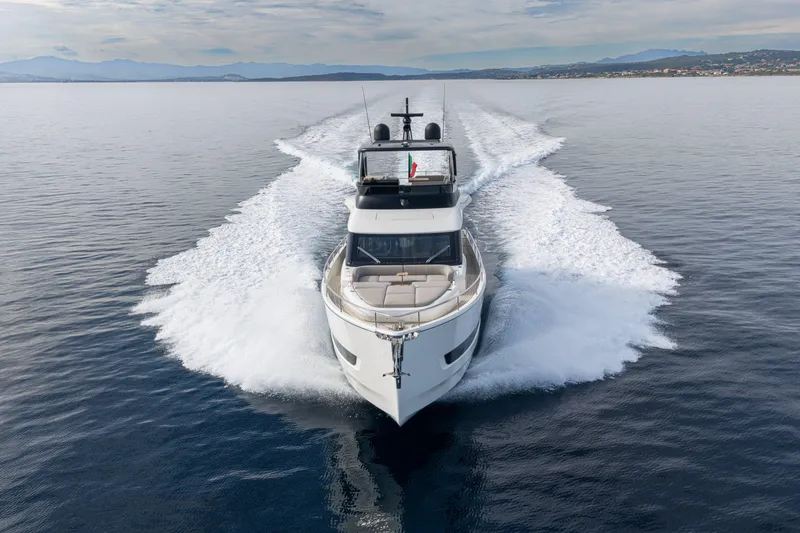Slide: The Image of 2026 Cranchi Sessantadue 62 yacht cruising on open water, creating a dynamic wake. - 25