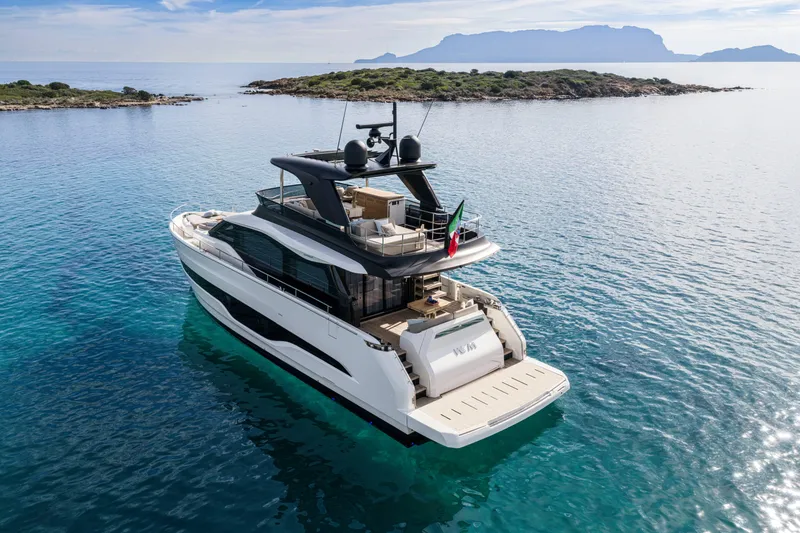 Slide: The Image of Luxurious 2026 Cranchi Sessantadue 62 yacht cruising in serene blue waters. - 15