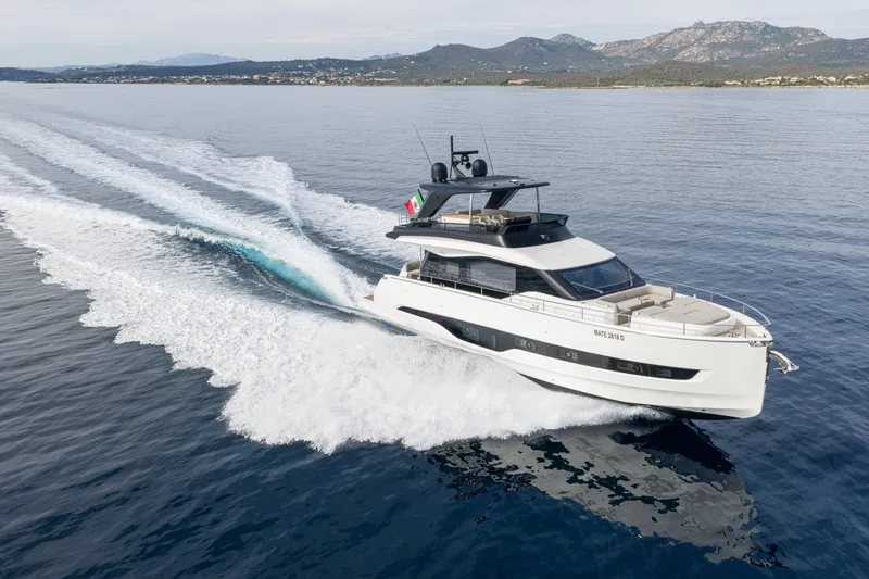 Slide: The Image of 2026 Cranchi Sessantadue 62 yacht cruising on open water, showcasing sleek design and luxury. - 24