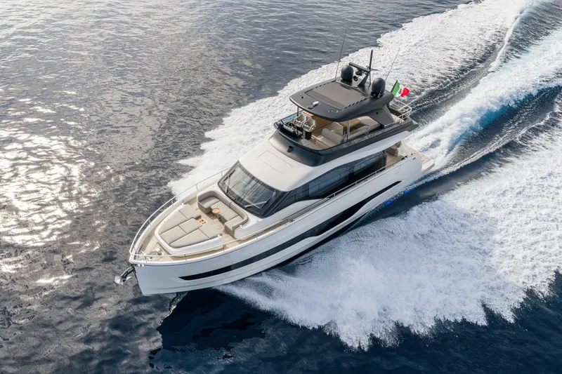 Slide: The Image of Luxurious 2026 Cranchi Sessantadue 62 yacht cruising on open water. - 27