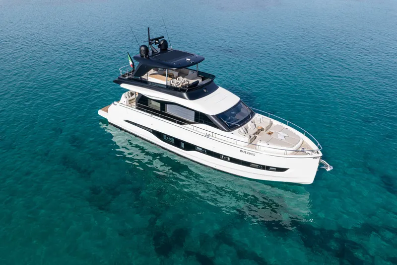 Slide: The Image of Luxurious 2026 Cranchi Sessantadue 62 yacht on clear blue water. - 11