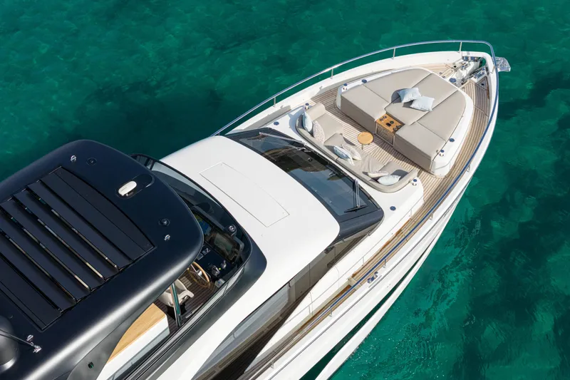 Slide: The Image of Luxurious 2026 Cranchi Sessantadue 62 yacht on clear turquoise water. - 16