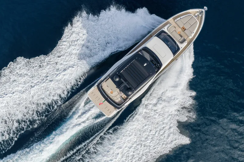 Slide: The Image of Aerial view of 2026 Cranchi Sessantadue 62 yacht cruising on open water. - 22