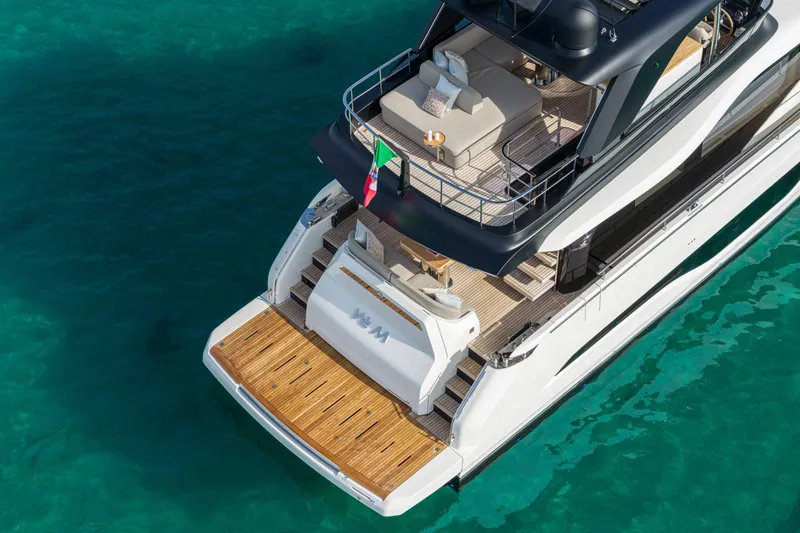 Slide: The Image of Luxury Cranchi Sessantadue 62 yacht, 2026 model, on clear turquoise water. - 17