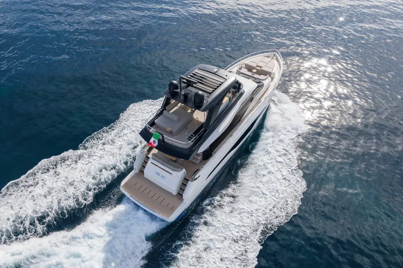 Slide: The Image of 2026 Cranchi Sessantadue 62 yacht cruising on open water, aerial view. - 21