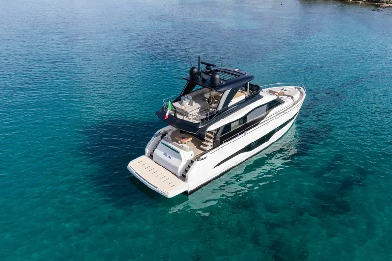 Slide: The Image of Luxury Cranchi Sessantadue 62 yacht, 2026 model, cruising in clear blue waters. - 13