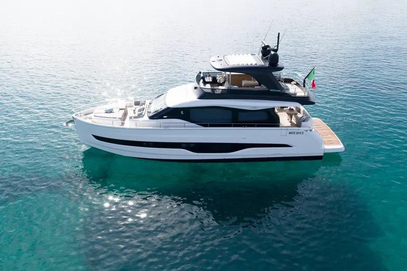 Slide: The Image of 2026 Cranchi Sessantadue 62 yacht on clear blue water, showcasing luxury design. - 8