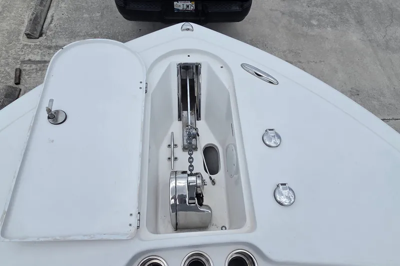 Slide: The Image of Bow of 2015 Tidewater 280 CC Adventure boat with anchor chain and storage compartment. - 11