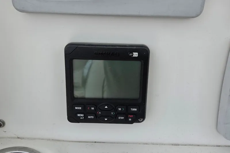 Slide: The Image of Simrad AP24 autopilot control on 2015 Tidewater 280 CC Adventure boat. - 21